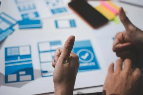 UI designer and UX developer brainstorm idea to design the application appe.. Stock Photos