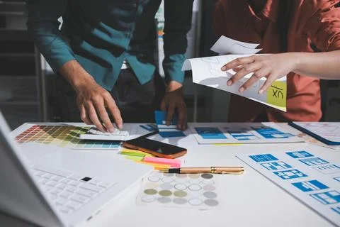 UI designer and UX developer brainstorm idea to design the application appe.. Stock Photos