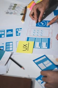 UI designer and UX developer brainstorm idea to design the application appe.. Stock Photos