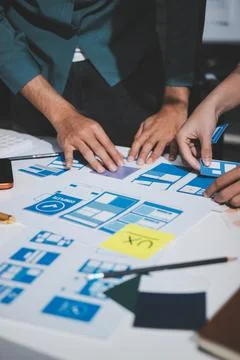 UI designer and UX developer brainstorm idea to design the application appe.. Stock Photos