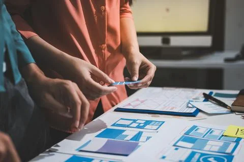 UI designer and UX developer brainstorm idea to design the application appe.. Stock Photos