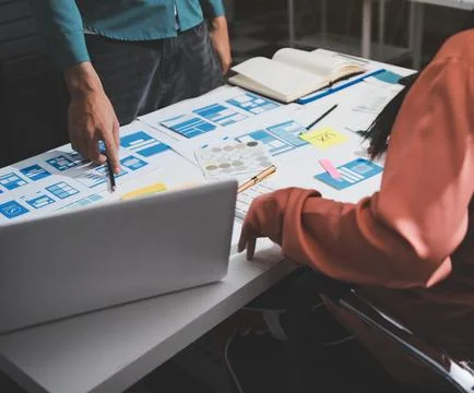 UI designer and UX developer brainstorm idea to design the application appe.. Stock Photos