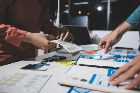 UI designer and UX developer brainstorm idea to design the application appe.. Stock Photos