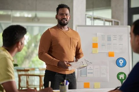 UI Designer Presenting Ideas Foto stock