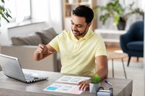 Ui designer working on user interface at home 스톡 사진