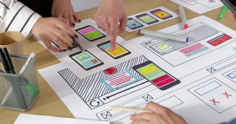 UI designers develop the interface on the desktop.  Stock Footage 229871091