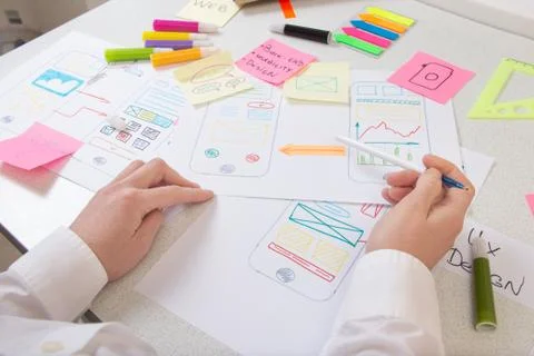 Ui Ux application designer working on desk in development office Stock Photos