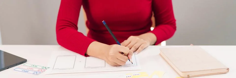 UI UX Designer Creating Mobile App Interface Design. Asian Woman Sketching .. Stock Photos