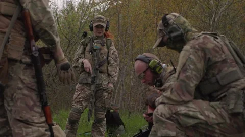 Ujrainian soldiers loading ammunition before attack Stock Footage 246414859