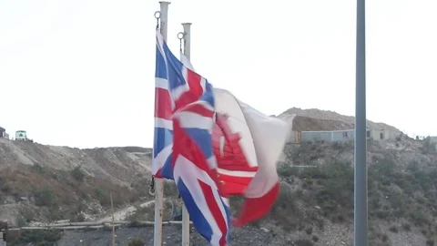 The UK and Gibraltar Flags Stock Footage 97177309