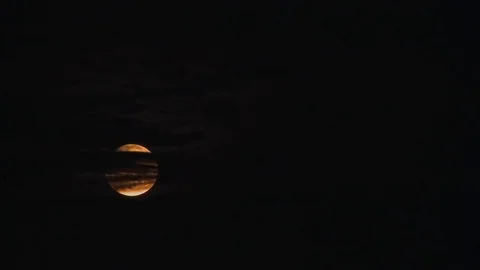 UK April 2013 - Time lapse of lunar eclipse full moon rising behind black cloud. Stock Footage 80979693