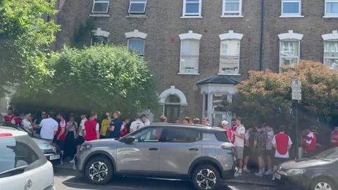 UK: Arsenal Fans Queue Spills Across Highbury Streets As Title Celebratio... Stock Footage 335666642