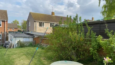 UK back garden in spring Stock Footage 185065821