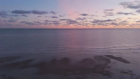 Uk, beach after sunset. beautiful high contrast sky colours. Stock Footage 295870093
