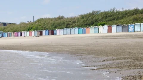 UK Beach with Beach huts Stock Footage 247456408