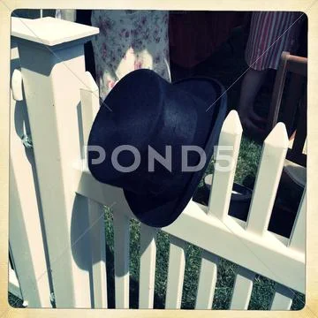 Uk, Berkshire, Ascot, Top Hat Hanging From Fence