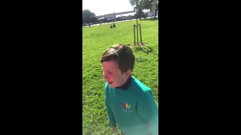 UK: Boy shields himself from seagulls in Blackpool, England, UK Stock Footage 336194346
