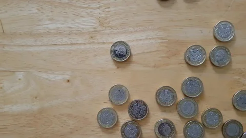 UK coins scatter on a tabletop Stock Footage 111017015