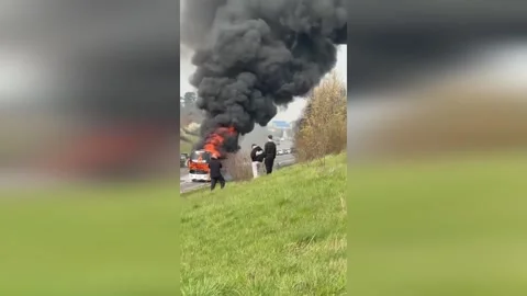 UK: Double-Decker Bus Engine Catches Fire On M6 Toll Road As Fans Evacuat... Stock Footage 331331299