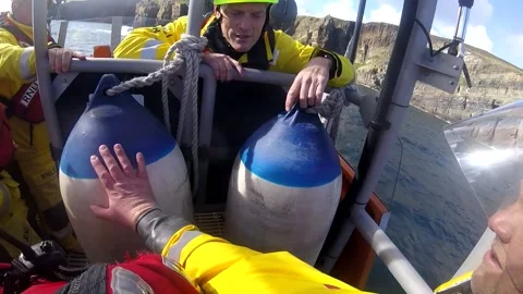 UK: Dramatic Cliff Fall Rescue at Whaligoe by Wick RNLI Lifeboat Crew Stock Footage 286898124
