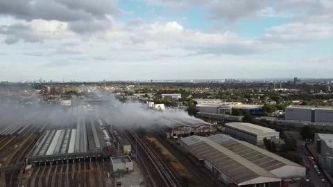 UK: DRONE - Huge fire at waste facility near Wembley sends smoke across L... Stock Footage 343888574