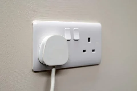 UK Electrical Plug In Dual 3-Pin Power Outlet on Wall Stock Photos