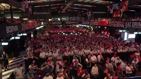 UK: Fans at BOXPARK Wembley react as England concede a late goal in Euro 202... Video stock 280449644