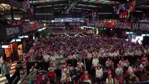 UK: Fans at BOXPARK Wembley react as England equalise in Euro 2024 final Stock Footage 280449750