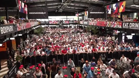 UK: Fans at Boxpark in Wembley react to England going 1-0 down to Slovakia Video stock 280488804