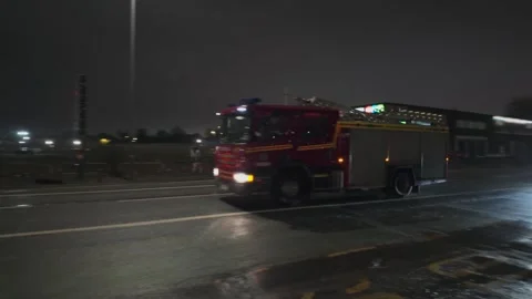 UK fire engine in busy city center at night. Hull.UK. 5.1.2026 Stock Footage 324624359