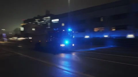 UK fire engine, busy city center at night. Emergency lights. Hull.UK. 5.12.2025 Stock Footage 324624362