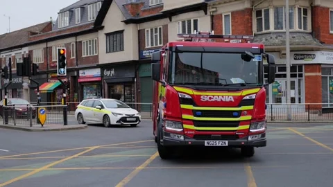 UK fire engine responding to an emergency, city center. Hull.UK 6.3.2026 Stock Footage 330262659