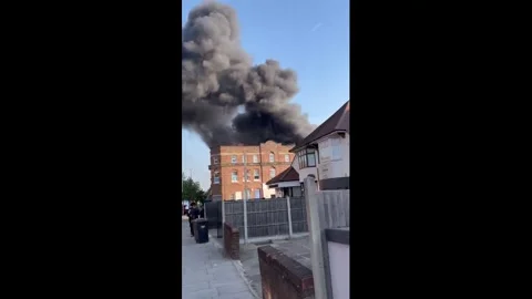 UK: Fire Erupts Behind Major North London Kosher Supermarket As Massive S... Stock Footage 335794278