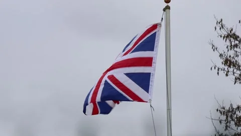 UK flag waving in the wind in 4K 60fps Stock Footage 320186173