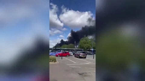 UK: Huge fire at waste facility near Wembley sends smoke across London, d... Stock Footage 343888567