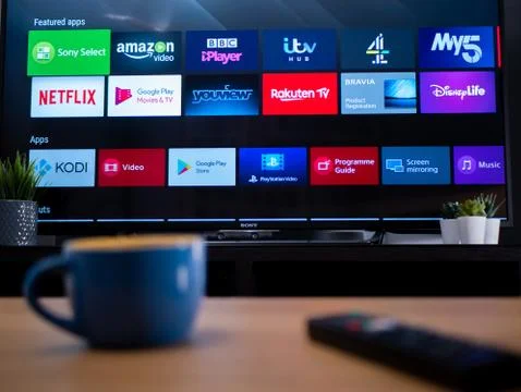 UK, Jan 2020: smart TV showing featured apps on android television screen Stock Photos