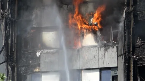 UK June 2017 - Flames drip like liquid from burning window frames in the Stock Footage 119085704