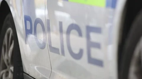 UK Law Enforcement: Focus pull through police sign on a British police car. Vídeos de archivo 69071611