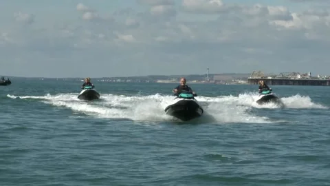 UK: Lib Dem leader Sir Ed Davey rides jet-ski in Brighton Stock Footage 284570261