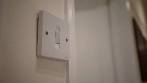 A UK light switched being turned off and on again Stock Footage 147047815