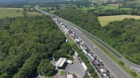 UK: Major M25 crash causes miles of traffic during heatwave in Surrey, En... Stock Footage 337600139