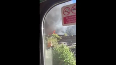 UK: Massive Bermondsey Recycling Centre Fire Sends Thick Black Smoke Acro... Stock Footage 336590683