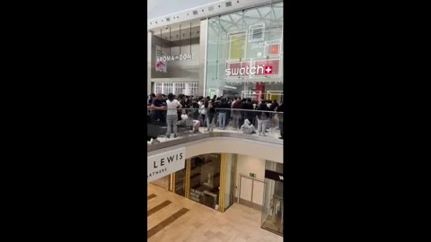 UK: Massive Crowd Gathers Outside Closed Swatch Store As Watch Launch Cha... Stock Footage 335185052