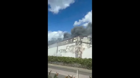 UK: Massive Industrial Fire Erupts Near Wembley Stadium in London Stock Footage 343867732