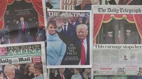 UK newspapers react to the inauguration of US President Donald Trump. Stock Footage 71645094