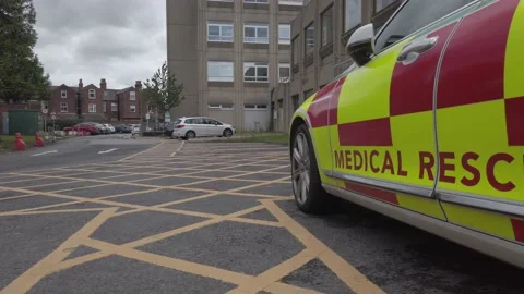 UK NHS emergency rapid response medical rescue service car outside Stock Footage 137975798
