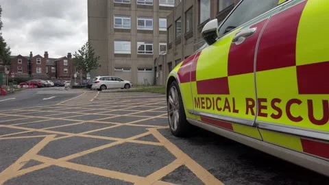 UK NHS emergency rapid response medical rescue service car outside Stock Footage 137975876