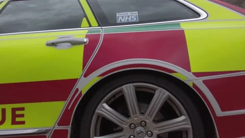 UK NHS emergency rapid response medical rescue service car outside Stock Footage 137975896