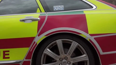 UK NHS emergency rapid response medical rescue service car outside Stock Footage 137975941