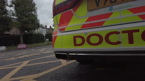 UK NHS emergency rapid response medical rescue service car outside Stock Footage 137975984